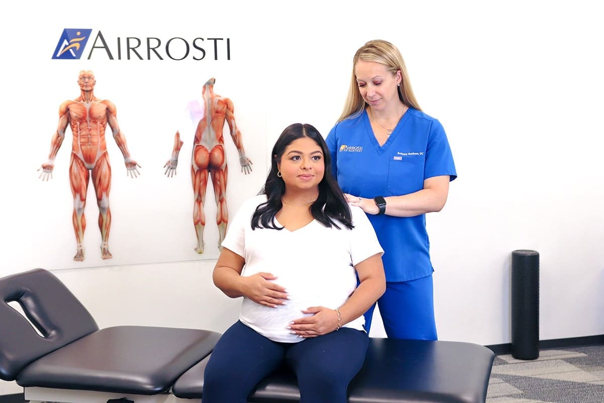 Airrosti doc treating pregnant woman