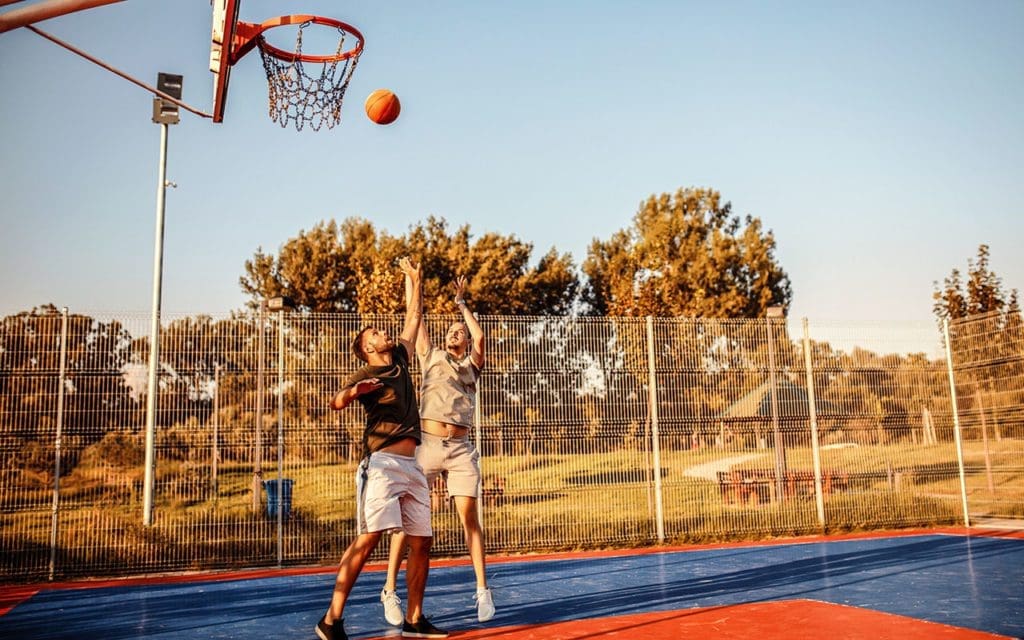 2 people playing basketball