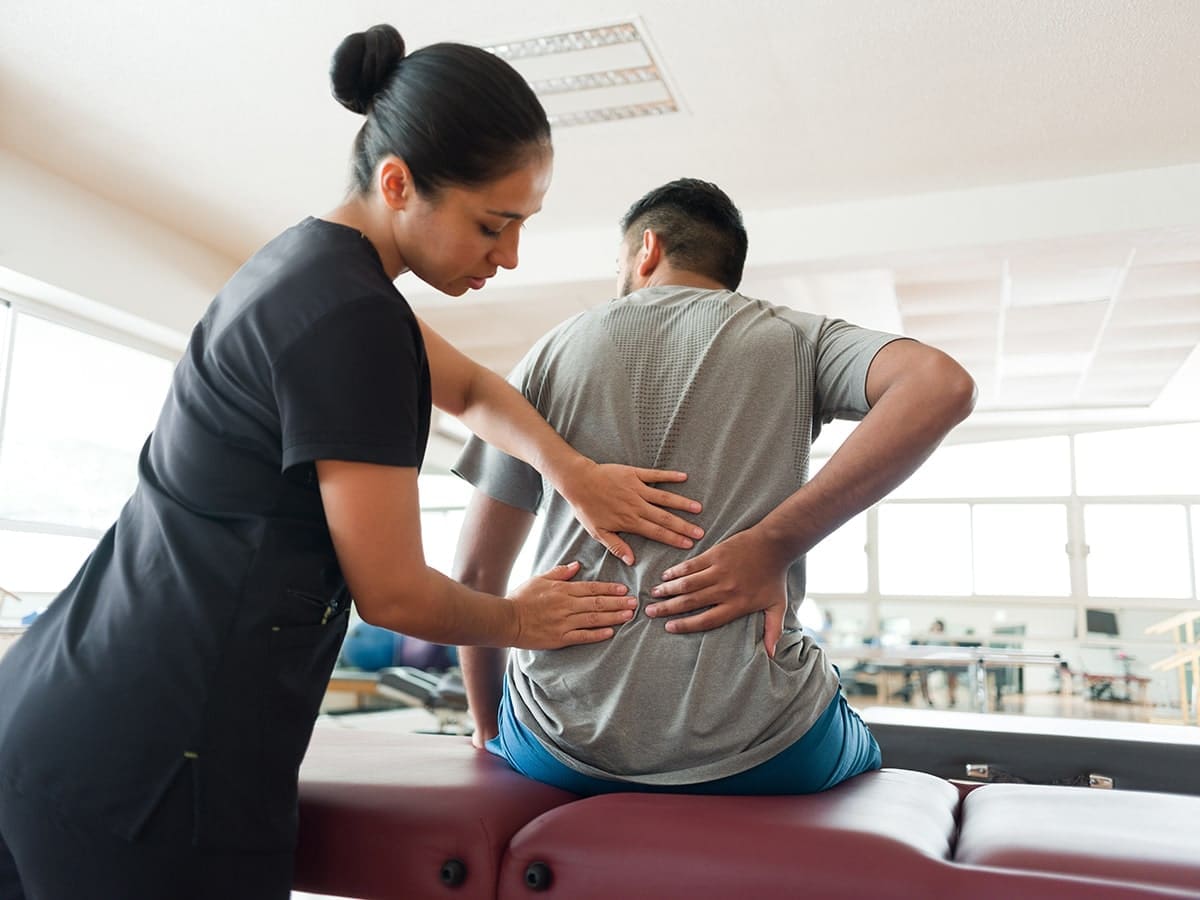 Man being treated for lower back pain