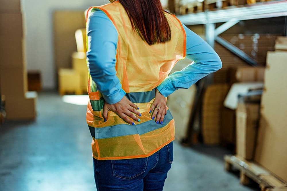 woman at work with lower back pain