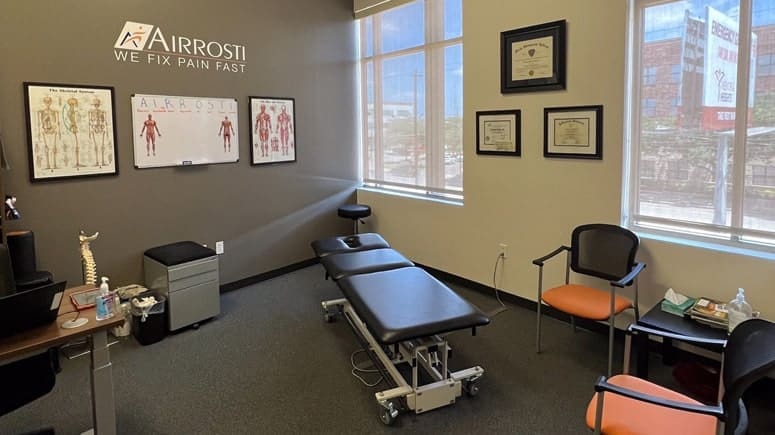 The treatment room at Airrosti Washington Heights where patient's will have a physical assessment to identify and treat their pain
