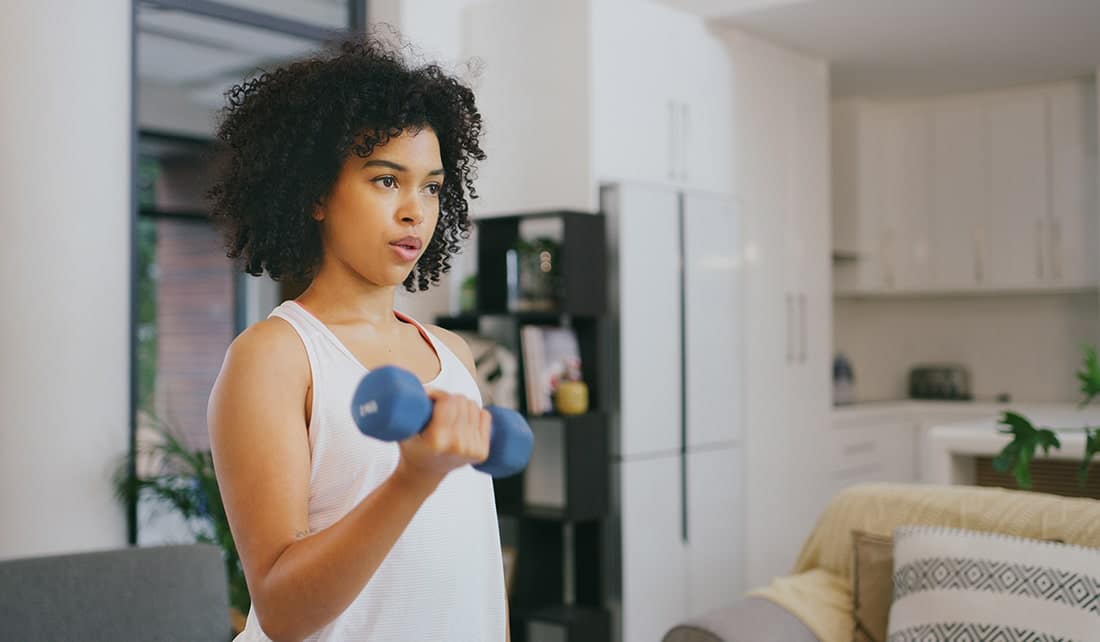 Woman doing bicep curls with weights