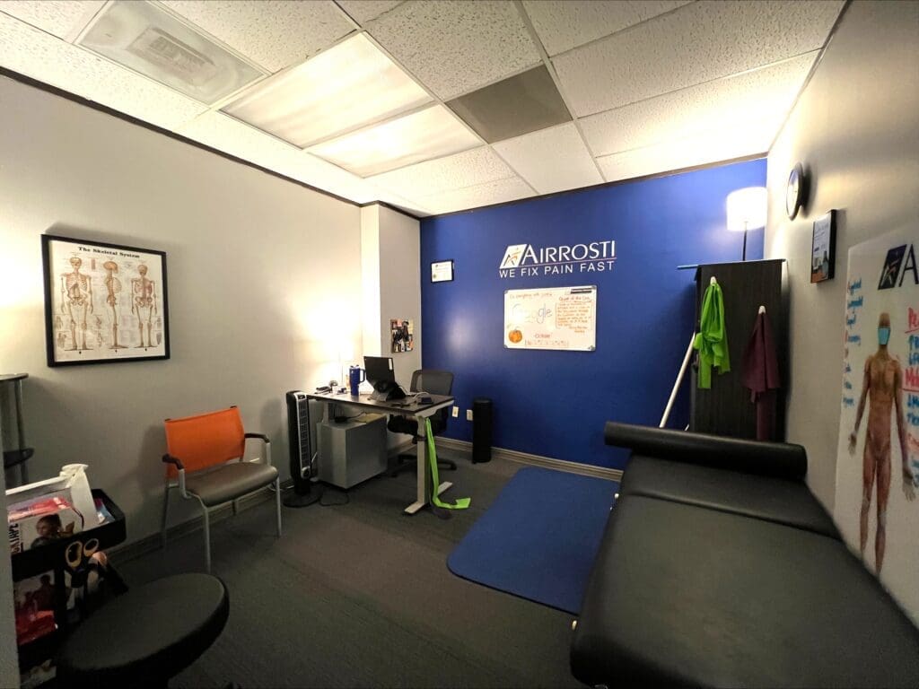 An inteiror photo of the recovery room at Airrosti Tanglewood. Photo features an exercise mat and exercise bands