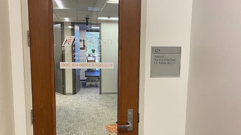 A view of the entrance to suite 125, where the Airrosti Fairfax offices are located.