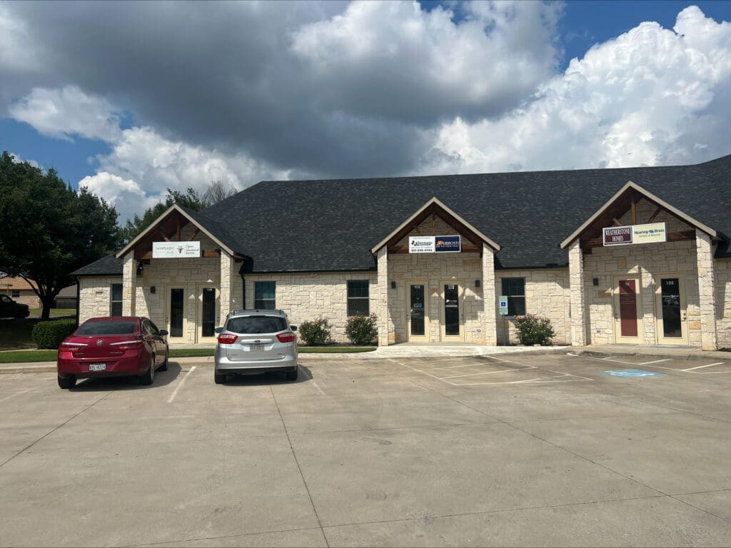 An zoomed out exterior view of the building where Airrosti Weatherford is located.