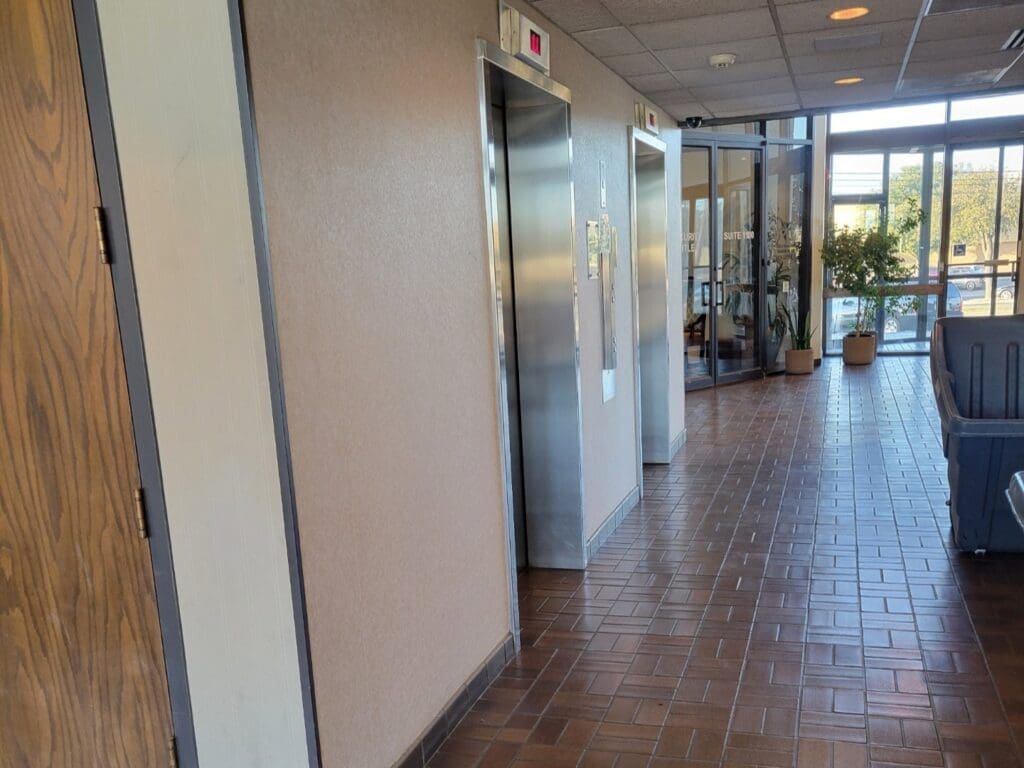 1st floor lobby and elevators at Airrosti Abilene